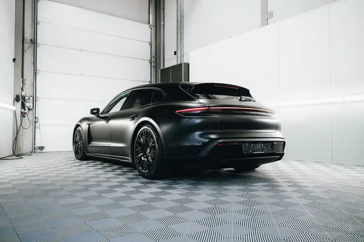 Black Car Getting Tinted In a Car Detailing Shop